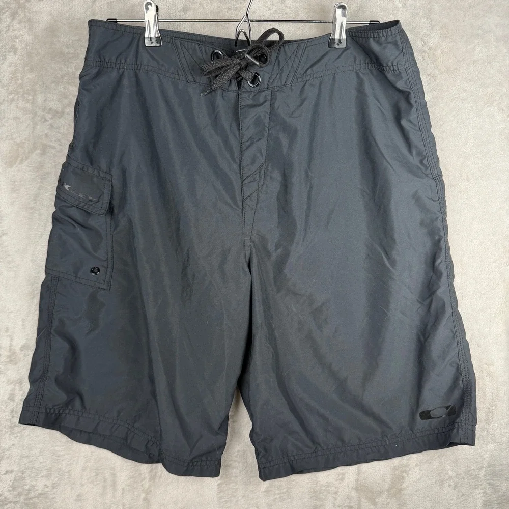 Oakley‎ Mens Black Board Shorts Size 34 Cargo Pocket Swim Trunks Lace Up Front
